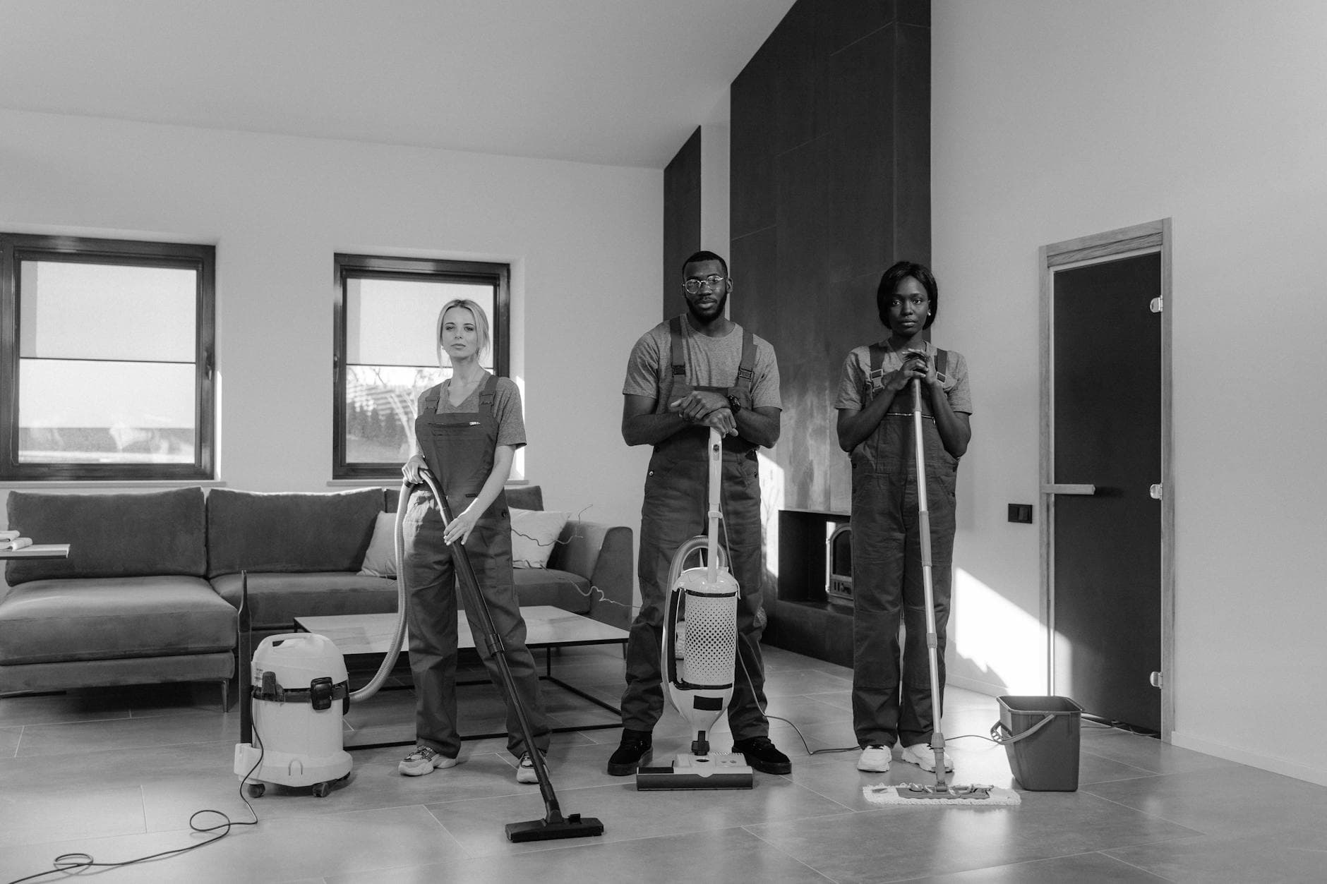 Three professional NYC Maid cleaners in uniform with equipment, ready for a job — Office Cleaning in SoHo, Manhattan